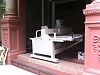 Pics of embroidery machine being moved-waiting-door-usps-worker-pick-up-deliver.jpg